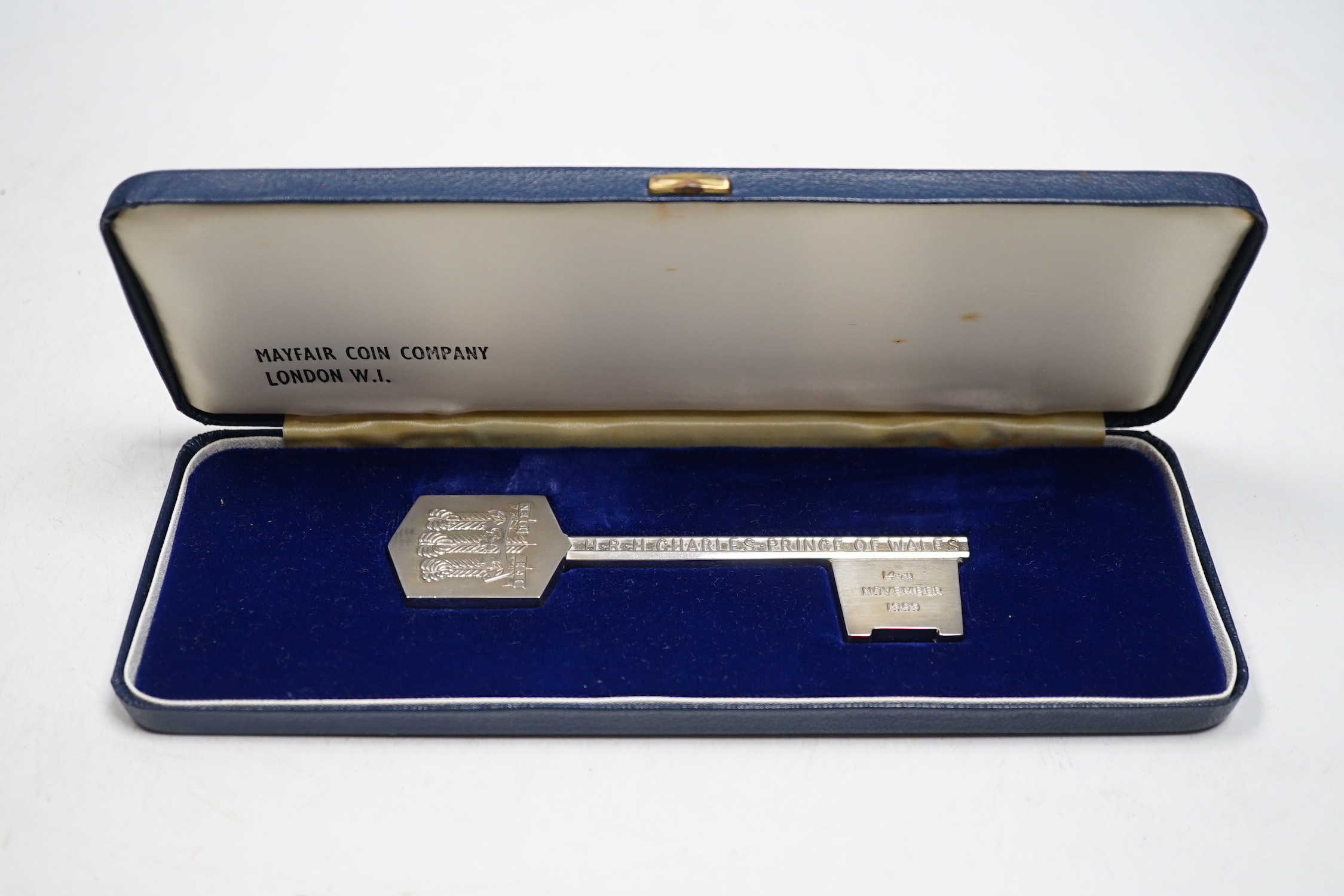 A cased Elizabeth II limited edition 'Prince of Wales Coming of Age' silver presentation key, Turner & Simpson, Birmingham, 1969, no. 27/1000, 12.7cm, 114 grams.